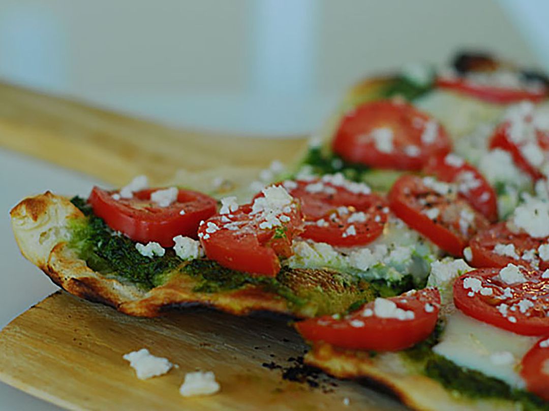 Pizza with Pesto sauce.